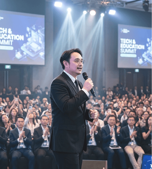 Dan Giang speaking to a large conference audience
