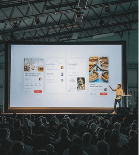 Dan Giang presenting a product demo on stage